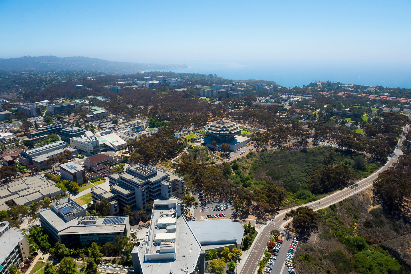 Aerial view of UC San Diego extending west toward the Pacific Ocean.